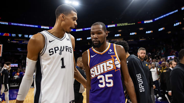 Nov 2, 2023; Phoenix, Arizona, USA; San Antonio Spurs center Victor Wembanyama (1) talks with Phoenix Suns forward Kevin Durant (35) following the game at Footprint Center. Mandatory Credit: Mark J. Rebilas-Imagn Images