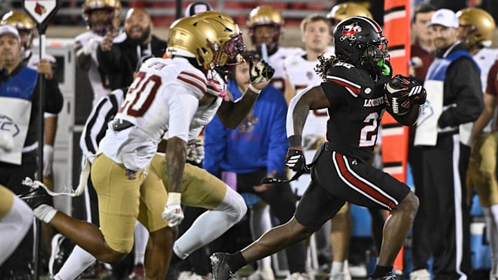 Oct 25, 2025; Louisville, Kentucky, USA; Louisville Cardinals running back Keyjuan Brown (22) runs the ball against the Boston College Eagles during the first half at L&N Federal Credit Union Stadium. Louisville defeated Boston College 38-24. Mandatory Credit: Jamie Rhodes-Imagn Images Oct 25, 2025; Louisville, Kentucky, USA; Louisville Cardinals running back Keyjuan Brown (22) runs the ball against the Boston College Eagles during the first half at L&N Federal Credit Union Stadium. Louisville defeated Boston College 38-24. Mandatory Credit: Jamie Rhodes-Imagn Images