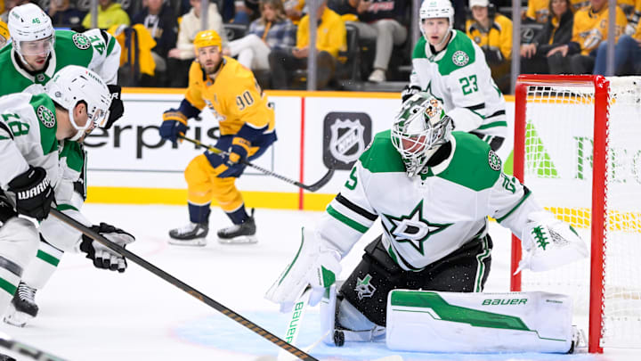 Oct 10, 2024; Nashville, Tennessee, USA; Dallas Stars goaltender Jake Oettinger (29) blocks the shot of Nashville Predators left wing Filip Forsberg (9) during the first period at Bridgestone Arena. Mandatory Credit: Steve Roberts-Imagn Images