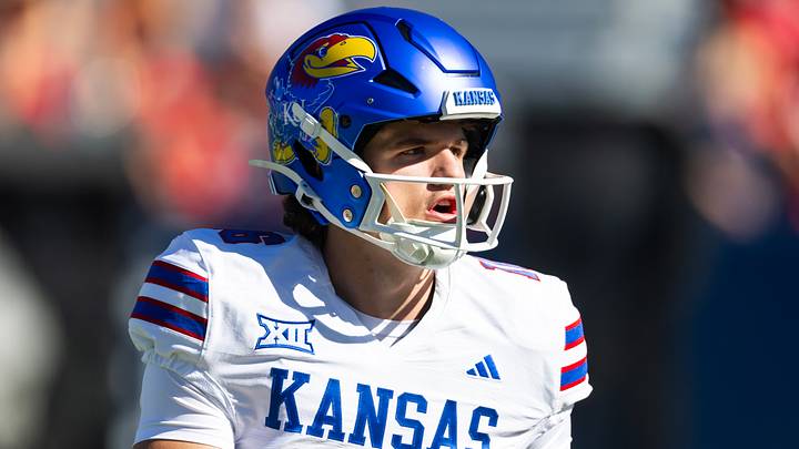 Nov 8, 2025; Tucson, Arizona, USA; Kansas Jayhawks quarterback David McComb (16) against the Arizona Wildcats at Arizona Stadium. Mandatory Credit: Mark J. Rebilas-Imagn Images Nov 8, 2025; Tucson, Arizona, USA; Kansas Jayhawks quarterback David McComb (16) against the Arizona Wildcats at Arizona Stadium. Mandatory Credit: Mark J. Rebilas-Imagn Images