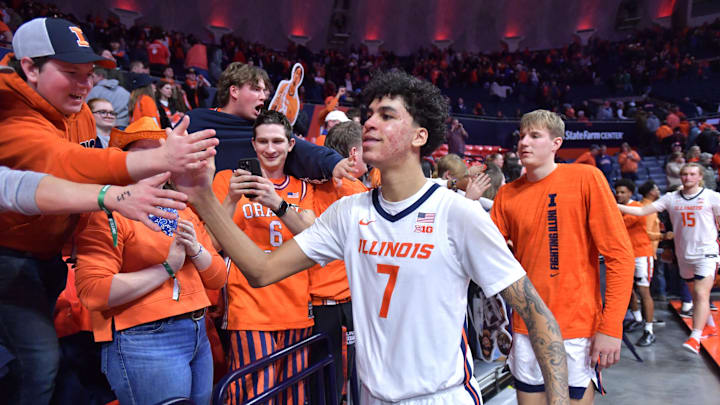 Feb 11, 2025; Champaign, Illinois, USA; Illinois Fighting Illini forward Will Riley (7) and teammates get a hand from the fans after a 83-78 win over the UCLA Bruins at State Farm Center. Feb 11, 2025; Champaign, Illinois, USA; Illinois Fighting Illini forward Will Riley (7) and teammates get a hand from the fans after a 83-78 win over the UCLA Bruins at State Farm Center.