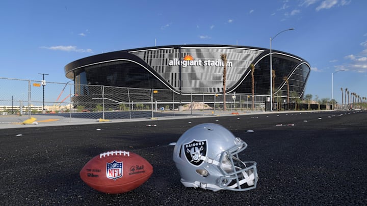 May 29, 2020; Las Vegas, Nevada, USA; General overall aerial view of Las Vegas Raiders helmet and Wilson 2020 NFL  The Duke  official football at the Allegiant Stadium construction site. The stadium will be the home of the Las Vegas Raiders and the UNLV Rebels football teams. It is located on about 62 acres of land west of Mandalay Bay at Russell Road and Hacienda Avenue and between Polaris Avenue and Dean Martin Drive, just west of Interstate 15. Construction of the $1.8 billion stadium began