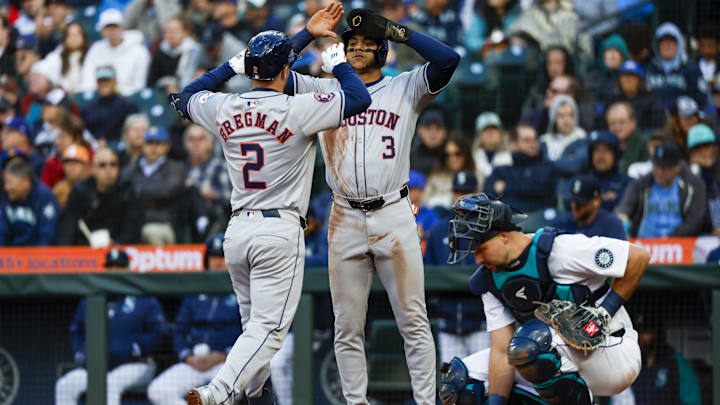 May 28, 2024; Seattle, Washington, USA; Houston Astros third baseman Alex Bregman (2) reacts with shortstop Jeremy Pena (3) after hitting a two-run home run against the Seattle Mariners during the fourth inning at T-Mobile Park. Mandatory Credit: Joe Nicholson-USA TODAY Sports
