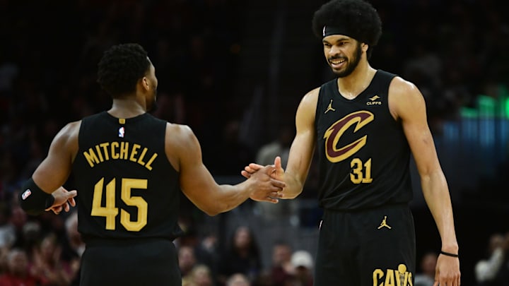 Apr 10, 2024; Cleveland, Ohio, USA; Cleveland Cavaliers guard Donovan Mitchell (45) and center Jarrett Allen (31) celebrate during the second half against the Memphis Grizzlies at Rocket Mortgage FieldHouse. Mandatory Credit: Ken Blaze-USA TODAY Sports