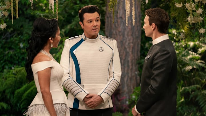 The Orville: New Horizons -- “Future Unknown” - Episode 310 -- A celebration is underway aboard the ship on the season three finale of “The Orville: New Horizons”. Dr. Claire Finn (Penny Johnson Jerald), Capt. Ed Mercer (Seth MacFarlane), and Issac (Mark Jackson), shown. (Photo by: Gilles Mingasson/Hulu)