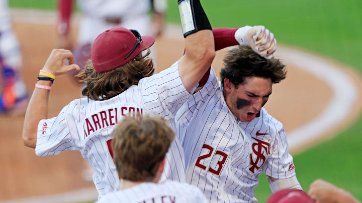Florida St. outfielder Brody DeLamielleure (23) celebrates his two-run home run with outfielder Gage Harrelson (9) during the fourth inning of an NCAA college baseball matchup Tuesday, March 25, 2025 at VyStar Ballpark in Jacksonville, Fla. FSU rallied to defeat UF 8-4 off a walk-off grand slam from Alex Lodise in the ninth inning. [Corey Perrine/Florida Times-Union]