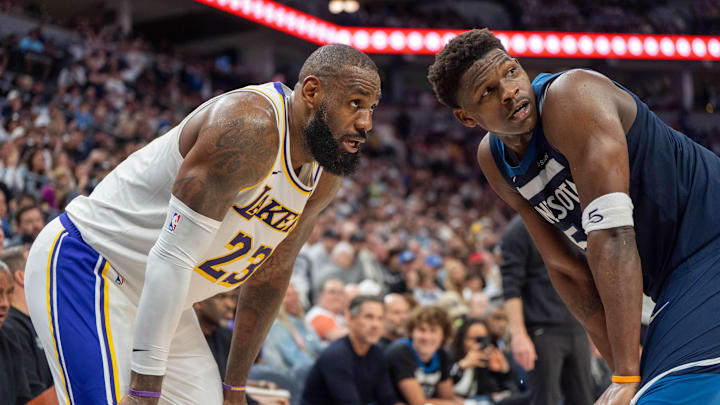 Apr 27, 2025; Minneapolis, Minnesota, USA; Minnesota Timberwolves guard Anthony Edwards (5) guards Los Angeles Lakers forward LeBron James (23) in the second quarter during game four of first round for the 2025 NBA Playoffs at Target Center. Mandatory Credit: Matt Blewett-Imagn Images