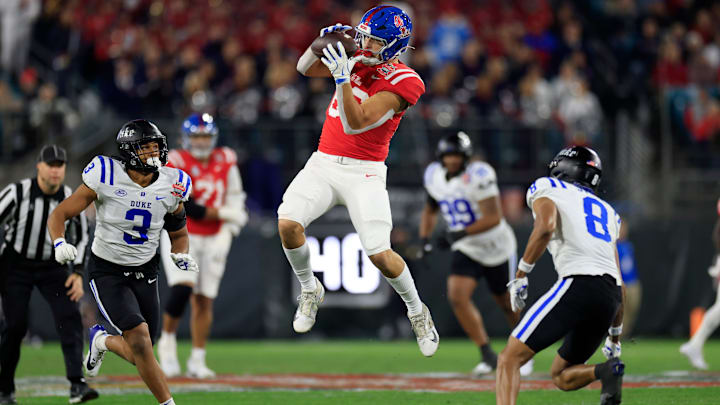 Mississippi Rebels tight end Caden Prieskorn (86) hauls in a reception between Duke Blue Devils linebacker Alex Howard (3) and safety DaShawn Stone (8) during the first quarter of the TaxSlayer Gator Bowl Thursday, Jan. 2, 2025 at EverBank Stadium in Jacksonville, Fla. [Corey Perrine/Florida Times-Union]