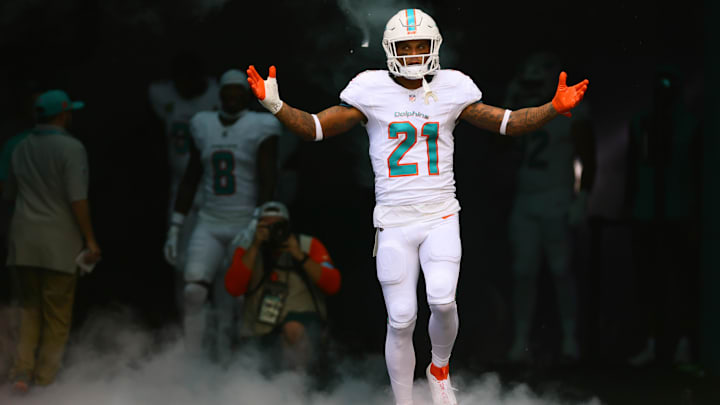 Miami Dolphins safety Jordan Poyer (21) runs onto the field before the game against the Jacksonville Jaguars.