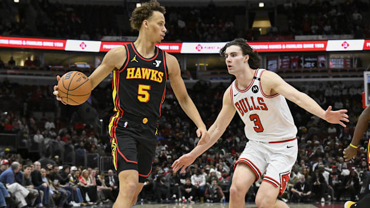 Jan 15, 2025; Chicago, Illinois, USA;  Atlanta Hawks guard Dyson Daniels (5) dribbles past Chicago Bulls guard Josh Giddey (3)