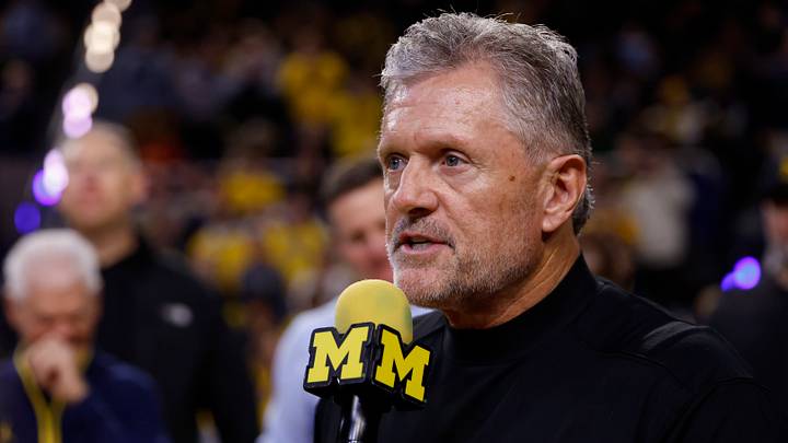 Jan 2, 2026; Ann Arbor, Michigan, USA; Michigan Wolverines football head coach Kyle Whittingham speaks to the crowd during a time out in the first half against the Southern California Trojans at Crisler Center. Mandatory Credit: Rick Osentoski-Imagn Images Jan 2, 2026; Ann Arbor, Michigan, USA; Michigan Wolverines football head coach Kyle Whittingham speaks to the crowd during a time out in the first half against the Southern California Trojans at Crisler Center. Mandatory Credit: Rick Osentoski-Imagn Images