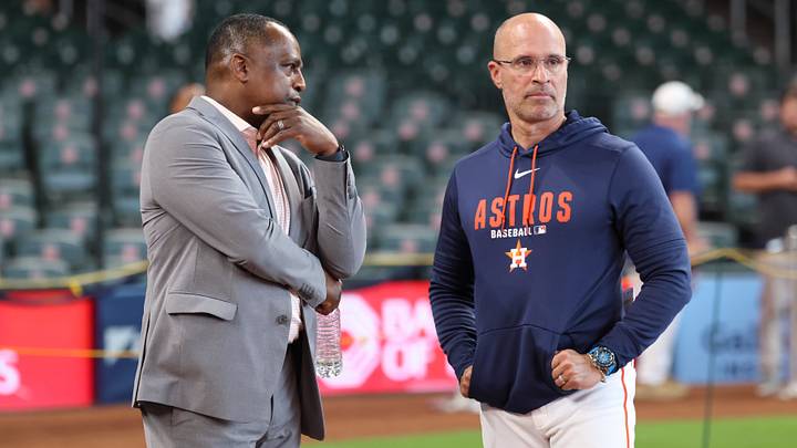 Houston Astros general manager Dana Brown (left) talks with manager Joe Espada. Houston Astros general manager Dana Brown (left) talks with manager Joe Espada.