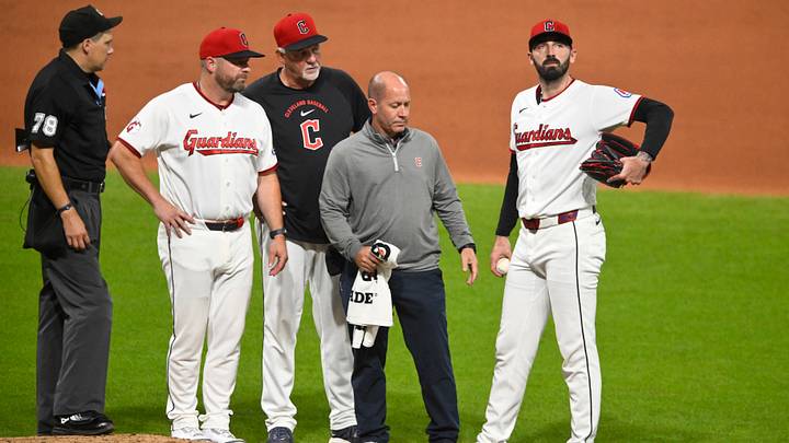 Aug 15, 2026: Cleveland Guardians relief pitcher Colin Holderman (right) reacts after suffering an apparent injury in the seventh inning against the San Diego Padres at Progressive Field. Credit: David Richard-Imagn Images