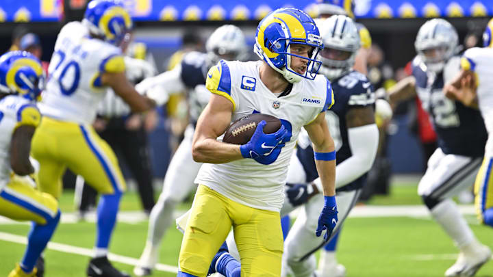 Oct 9, 2022; Inglewood, California, USA; Los Angeles Rams wide receiver Cooper Kupp (10) carries the ball during the second quarter against the Dallas Cowboys at SoFi Stadium. Mandatory Credit: Robert Hanashiro-Imagn Images