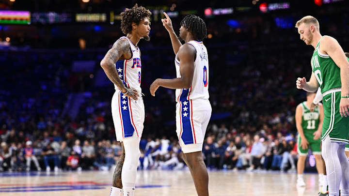 Oct 11, 2023; Philadelphia, Pennsylvania, USA; Philadelphia 76ers guard Tyrese Maxey (0) talks with guard Kelly Oubre Jr (9) against the Boston Celtics in the second quarter at Wells Fargo Center. Mandatory Credit: Kyle Ross-Imagn Images