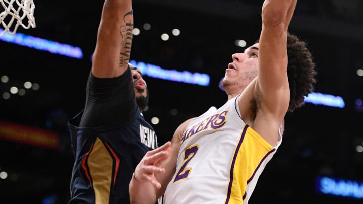 Oct 22, 2017; Los Angeles, CA, USA; Los Angeles Lakers guard Lonzo Ball (2) hangs in the air as he tries to score over New Orleans Pelicans forward Anthony Davis (23) during the fourth quarter at Staples Center. Davis blocked the shot by Ball. Mandatory Credit: Robert Hanashiro-USA TODAY Sports