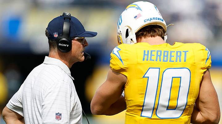 Chargers head coach Jim Harbaugh speaks with QB Justin Herbert Chargers head coach Jim Harbaugh speaks with QB Justin Herbert