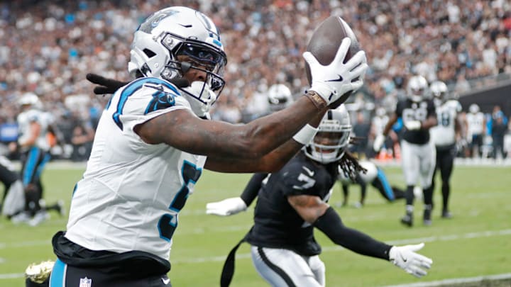LAS VEGAS, NEVADA - SEPTEMBER 22: Diontae Johnson #5 of the Carolina Panthers catches a pass for a touchdown in front of Tre'von Moehrig #7 of the Las Vegas Raiders during the second quarter at Allegiant Stadium on September 22, 2024 in Las Vegas, Nevada.