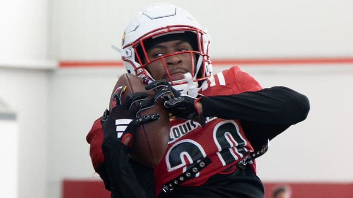 Louisville football Tayon Holloway (20) runs drills during spring practice on Saturday, March 23, 2024 at the Trager practice facility in Louisville, Ky. Louisville football Tayon Holloway (20) runs drills during spring practice on Saturday, March 23, 2024 at the Trager practice facility in Louisville, Ky.