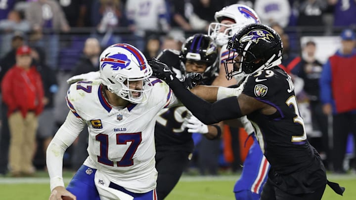 Sep 29, 2024; Baltimore, Maryland, USA; Buffalo Bills quarterback Josh Allen (17) scrambles from Baltimore Ravens safety Eddie Jackson (39) at M&T Bank Stadium