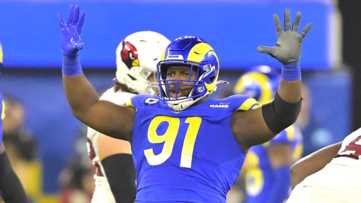 Dec 28, 2024; Inglewood, California, USA;  Los Angeles Rams defensive tackle Kobie Turner (91) celebrates after sackiing Arizona Cardinals quarterback Kyler Murray (1) in the second half at SoFi Stadium. Mandatory Credit: Jayne Kamin-Oncea-Imagn Images