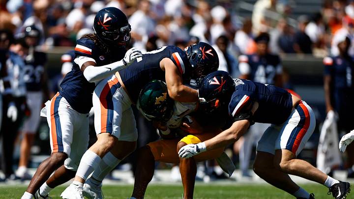 The Cavaliers swarm to tackle the Tribe ballcarrier in a 55-16 win over William & Mary, Sept. 13, 2025. The Cavaliers swarm to tackle the Tribe ballcarrier in a 55-16 win over William & Mary, Sept. 13, 2025.