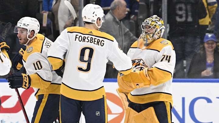 Feb 17, 2024; St. Louis, Missouri, USA; Nashville Predators left wing Filip Forsberg (9) congratulates goaltender Juuse Saros (74) after defeating the St. Louis Blues at Enterprise Center. Mandatory Credit: Jeff Le-Imagn Images