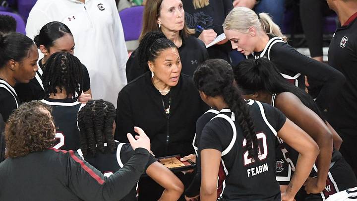 South Carolina Coach Dawn Staley talks with players in a break from playing Clemson during the second quarter at Littlejohn Coliseum Wednesday, Nov. 20, 2024 in Clemson, SC.