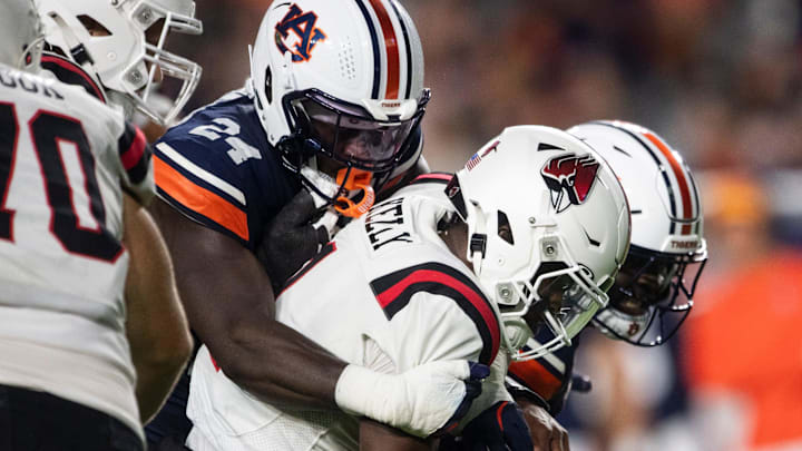 Auburn Tigers buck Keyron Crawford (24) sacks Ball State Cardinals quarterback Kiael Kelly (1) as Auburn Tigers take on Ball State Cardinals at Jordan-Hare Stadium in Auburn, Ala. on Saturday, Sept. 6, 2025. Auburn Tigers lead Ball State Cardinals 21-0 at halftime.