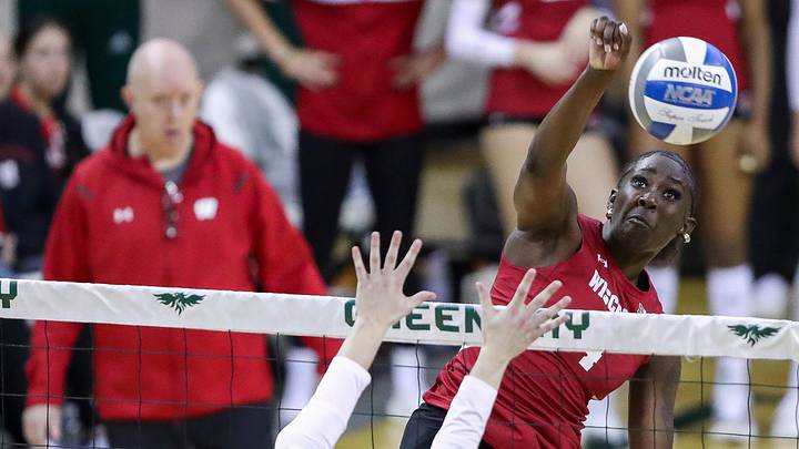 Wisconsin's Jaela Auguste (4) spikes the ball. Tork Mason/USA TODAY NETWORK-Wisconsin