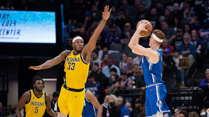 Jan 18, 2024; Sacramento, California, USA; Sacramento Kings guard Kevin Huerter (9) takes a three point shot over Indiana Pacers center Myles Turner (33) during the fourth quarter at Golden 1 Center. Mandatory Credit: Ed Szczepanski-Imagn Images