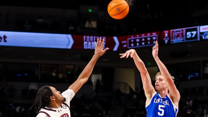 Feb 24, 2026; Columbia, South Carolina, USA; Kentucky Wildcats guard Collin Chandler (5) makes a three point basket over South Carolina Gamecocks guard Kobe Knox (4) during the second half at Colonial Life Arena. Mandatory Credit: Jeff Blake-Imagn Images Feb 24, 2026; Columbia, South Carolina, USA; Kentucky Wildcats guard Collin Chandler (5) makes a three point basket over South Carolina Gamecocks guard Kobe Knox (4) during the second half at Colonial Life Arena. Mandatory Credit: Jeff Blake-Imagn Images