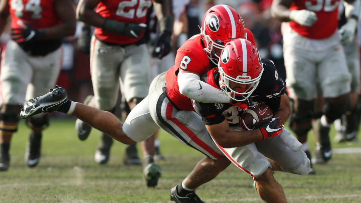 Georgia defensive back Joenel Aguero (8) tackles Georgia wide receiver Mekhi Mews (87) during the UGA G-Day spring football game at Sanford Stadium in Athens, Ga., on Saturday, April 15, 2023. Red won 31-26.

News Joshua L Jones