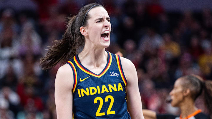 Jun 14, 2025; Indianapolis, Indiana, USA; Indiana Fever guard Caitlin Clark (22) celebrates a made basket in the first half against the New York Liberty at Gainbridge Fieldhouse. Mandatory Credit: Trevor Ruszkowski-Imagn Images
