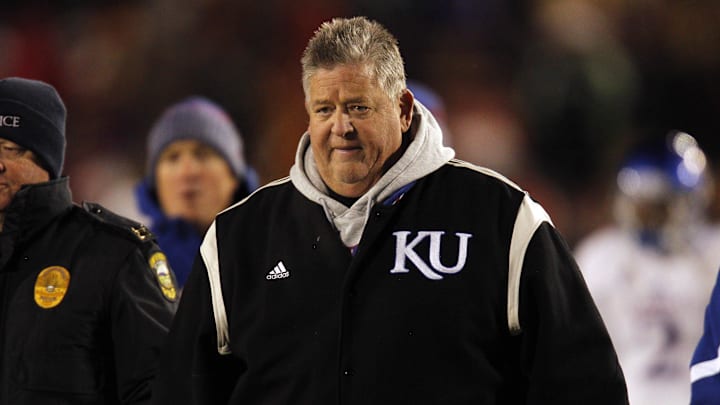 Nov 23, 2013; Ames, IA, USA; Kansas Jayhawks head coach Charlie Weis leaves the field at half time against the Iowa State Cyclones at Jack Trice Stadium. Iowa State won 34-0. Mandatory Credit: Bruce Thorson-Imagn Images