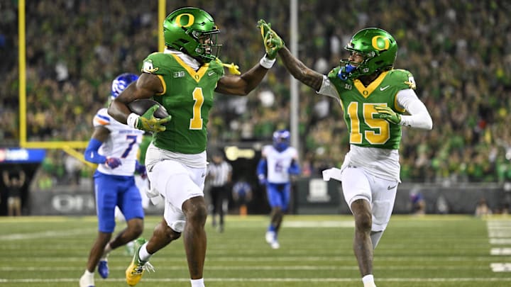 Oregon Ducks wide receiver Traeshon Holden high-fives wide receiver Tez Johnson as he scores a touchdown against Boise State.
