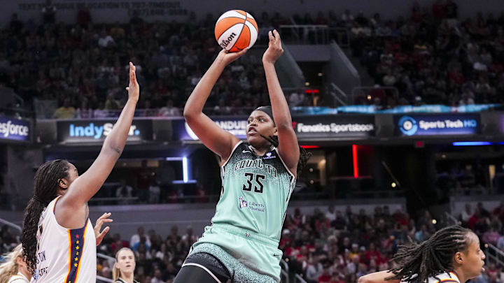 May 24, 2025; Indianapolis, Indiana, USA; New York Liberty center Jonquel Jones (35) goes up for a basket against Indiana Fever forward Aliyah Boston (7) on Saturday, May 24, 2025, during a game between the Indiana Fever and the New York Liberty at Gainbridge Fieldhouse. Mandatory Credit: Grace Smith/USA Today Network via Imagn Images