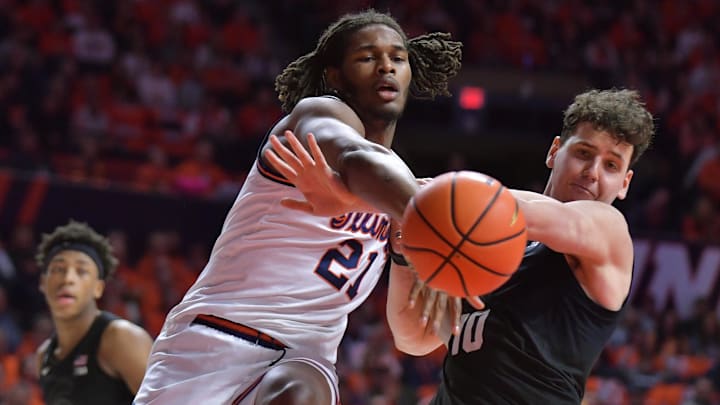 Feb 15, 2025; Champaign, Illinois, USA;  Illinois Fighting Illini forward Morez Johnson Jr. (21) and Michigan State Spartans center Szymon Zapala (10) vie for a loose ball during the first half at State Farm Center. Mandatory Credit: Ron Johnson-Imagn Images
