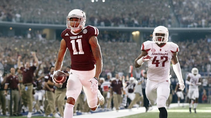 Sep 27, 2014; Arlington, TX, USA; Texas A&M Aggies receiver Josh Reynolds (11) scores the game tying touchdown in the fourth quarter against the Arkansas Razorbacks at AT&T Stadium. The Aggies beat the Razorbacks 35-28.  Mandatory Credit: Matthew Emmons-Imagn Images