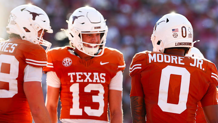 Texas Longhorns wide receiver DeAndre Moore Jr. celebrates with Texas Longhorns wide receiver Parker Livingstone after scoring a touchdown during the second half against the Oklahoma Sooners at the Cotton Bowl. Texas Longhorns wide receiver DeAndre Moore Jr. celebrates with Texas Longhorns wide receiver Parker Livingstone after scoring a touchdown during the second half against the Oklahoma Sooners at the Cotton Bowl.