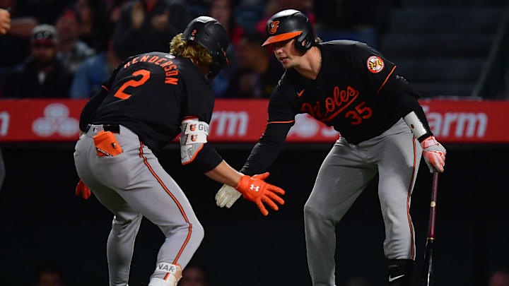 Apr 23, 2024; Anaheim, California, USA; Baltimore Orioles shortstop Gunnar Henderson (2) is greeted by catcher Adley Rutschman (35) after hitting a solo home run against the Los Angeles Angels during the seventh inning at Angel Stadium. 