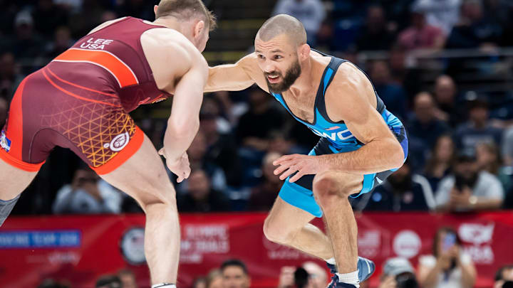 Thomas Gilman (right) wrestles Spencer Lee in the 57-kilogram men's freestyle championship series during the 2024 U.S. Olympic Team Trials in State College.