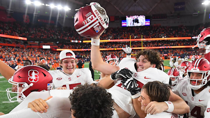 Sep 20, 2024; Syracuse, New York, USA; Stanford Cardinal place kicker Emmet Kenney (13) is carried by teammates following his game winning field goal against the Syracuse Orange at the JMA Wireless Dome. Mandatory Credit: Rich Barnes-Imagn Images