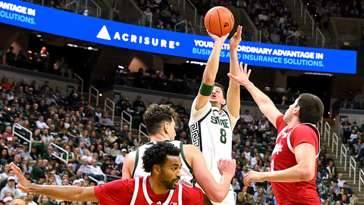 Dec 7, 2024; East Lansing, Michigan, USA;  Michigan State Spartans forward Frankie Fidler (8) puts in a jump shot over the Nebraska Cornhuskers defense during the second half at Jack Breslin Student Events Center. Mandatory Credit: Dale Young-Imagn Images