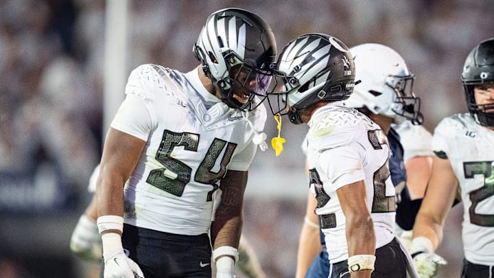 Oregon inside linebacker Jerry Mixon, left and Oregon defensive back Jadon Canady celebrate as the Oregon Ducks face the Penn State Nittany Lions on Sept. 27, 2025, at Beaver Stadium in University Park, Pennsylvania.