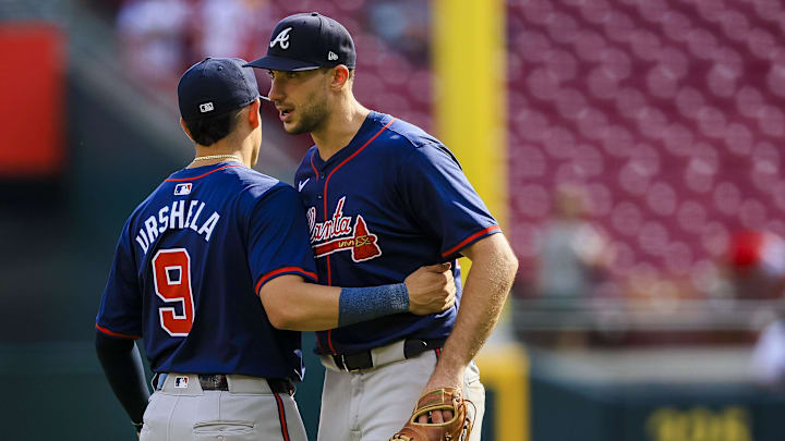 Atlanta Braves third baseman Gio Urshela hugs first baseman Matt Olson