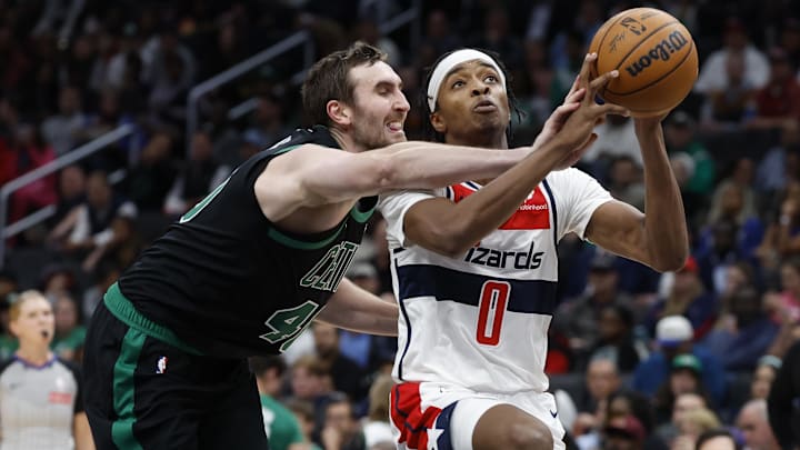 Oct 24, 2024; Washington, District of Columbia, USA; Washington Wizards guard Bilal Coulibaly (0) drives to the basket as Boston Celtics center Luke Kornet (40) defends in the second half at Capital One Arena. Mandatory Credit: Geoff Burke-Imagn Images