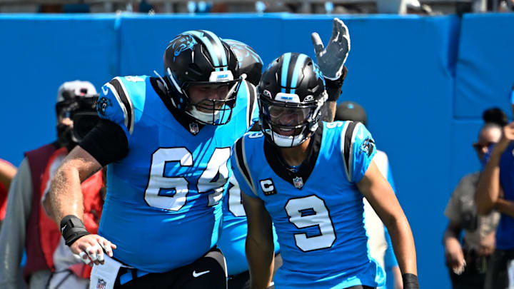 Sep 21, 2025; Charlotte, North Carolina, USA; Carolina Panthers quarterback Bryce Young (9) celebrates with center Cade Mays (64) after scoring a touchdown in the first quarter at Bank of America Stadium. Mandatory Credit: Bob Donnan-Imagn Images Sep 21, 2025; Charlotte, North Carolina, USA; Carolina Panthers quarterback Bryce Young (9) celebrates with center Cade Mays (64) after scoring a touchdown in the first quarter at Bank of America Stadium. Mandatory Credit: Bob Donnan-Imagn Images