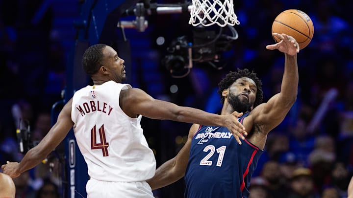 Nov 21, 2023; Philadelphia, Pennsylvania, USA; Philadelphia 76ers center Joel Embiid (21) defends the shot attempt of Cleveland Cavaliers forward Evan Mobley (4) during the fourth quarter at Wells Fargo Center. Mandatory Credit: Bill Streicher-Imagn Images Nov 21, 2023; Philadelphia, Pennsylvania, USA; Philadelphia 76ers center Joel Embiid (21) defends the shot attempt of Cleveland Cavaliers forward Evan Mobley (4) during the fourth quarter at Wells Fargo Center. Mandatory Credit: Bill Streicher-Imagn Images