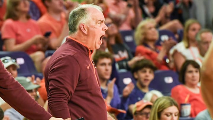 Virginia Tech head coach Mike Young communicates with his team playing Clemson during the first half at Littlejohn Coliseum in Clemson, S.C.